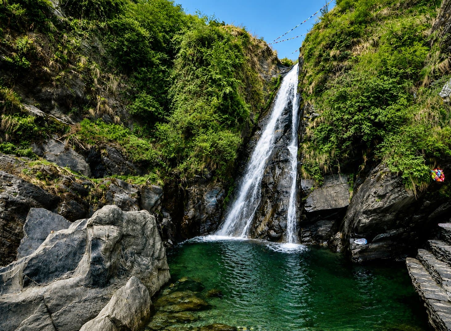 The pool at the base of Bhagsu Waterfall near Mcleodganj