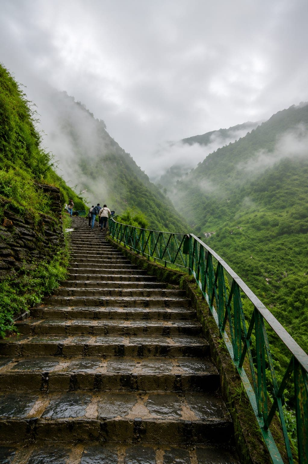 Misty stone steps on the trail to Bhagsu Waterfall