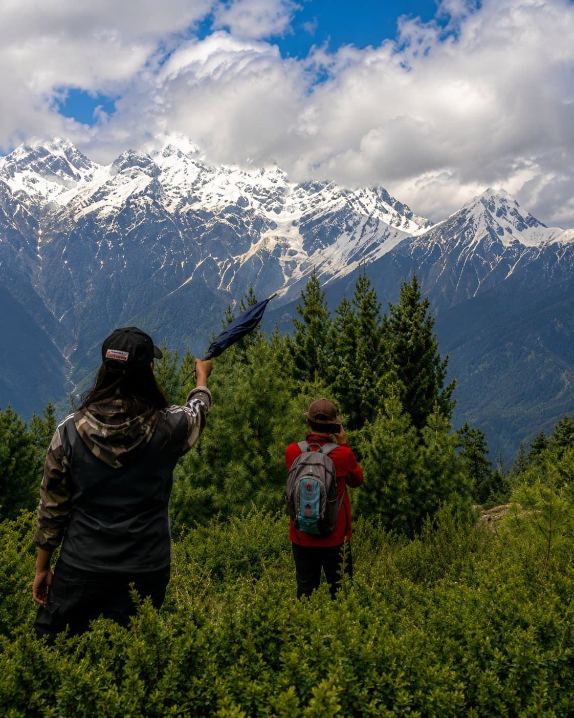 Trekkers taking in the mountain view at Chaka Meadows near Kalpa