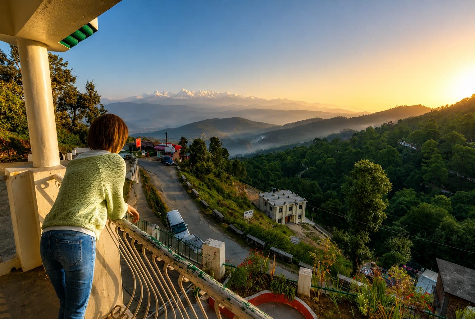 A traveller watching the Himalayan sunrise from a Kausani viewpoint