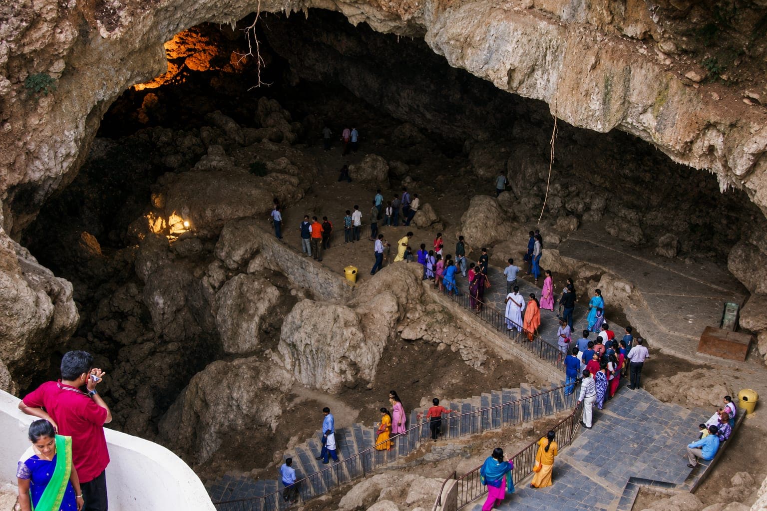 Visitors descending into the Patal Bhuvaneshwar limestone cave