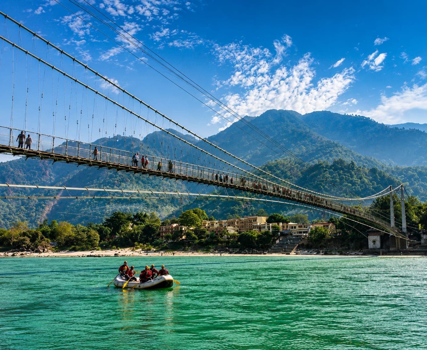 River rafting below a suspension bridge in Rishikesh