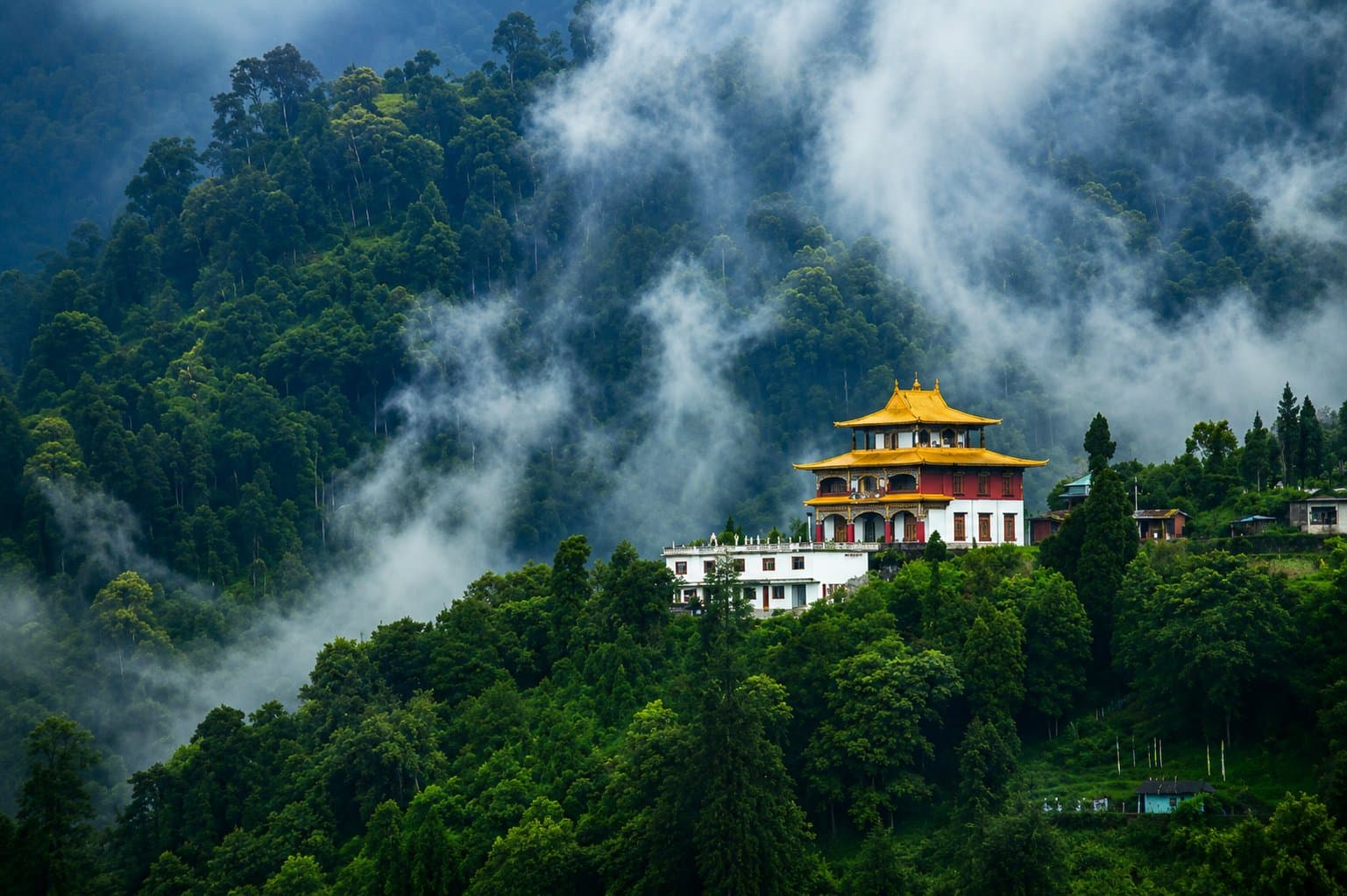 A monastery on a misty forested hill near Gangtok, Sikkim