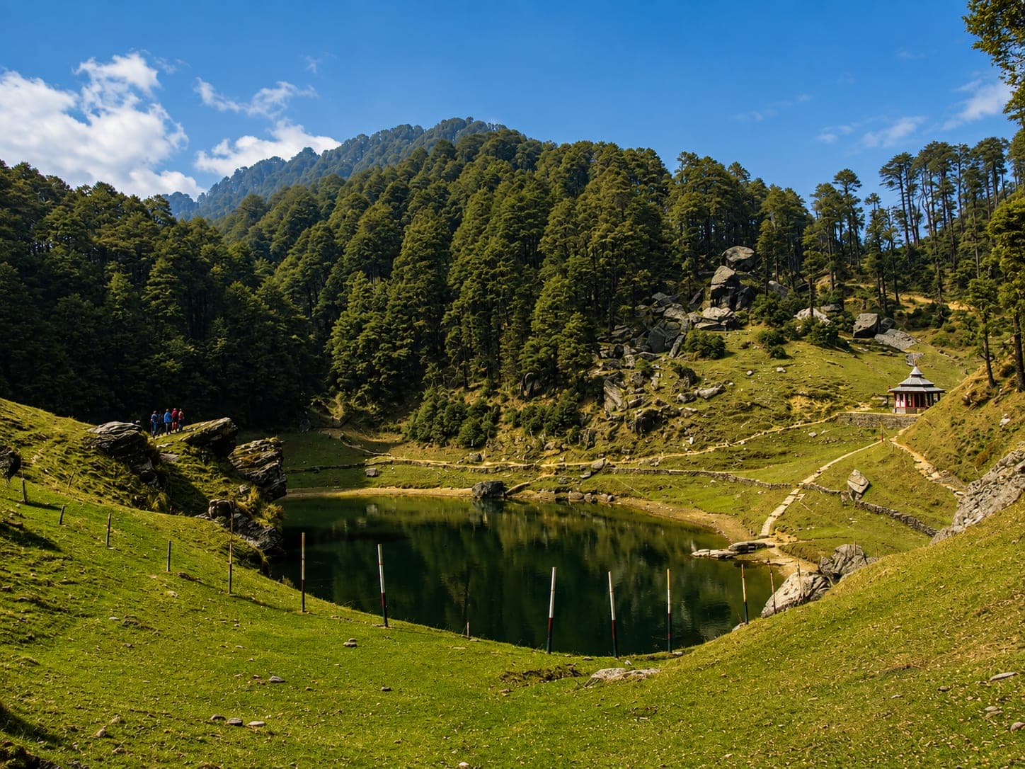 Serolsar Lake surrounded by pine forest near Jalori Pass